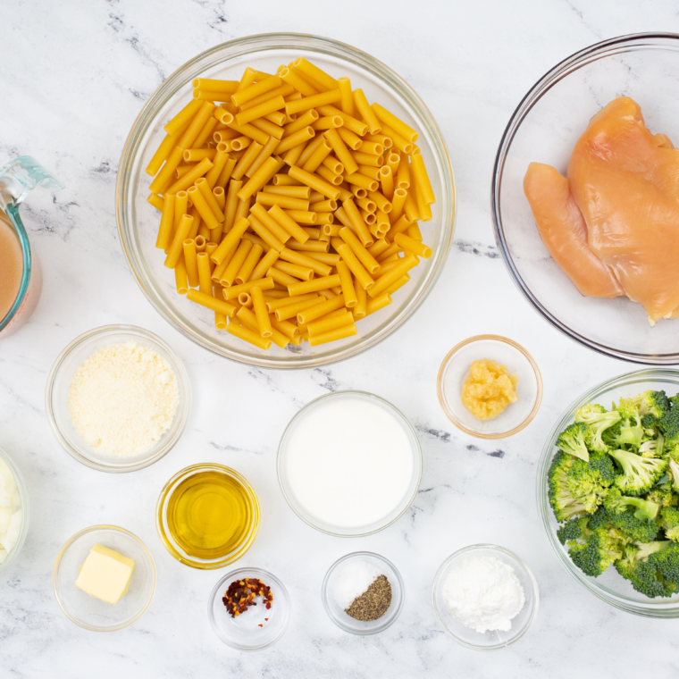 Ingredients needed for Fazoli's Chicken Broccoli Penne (Copycat Recipe!) on kitchen table.