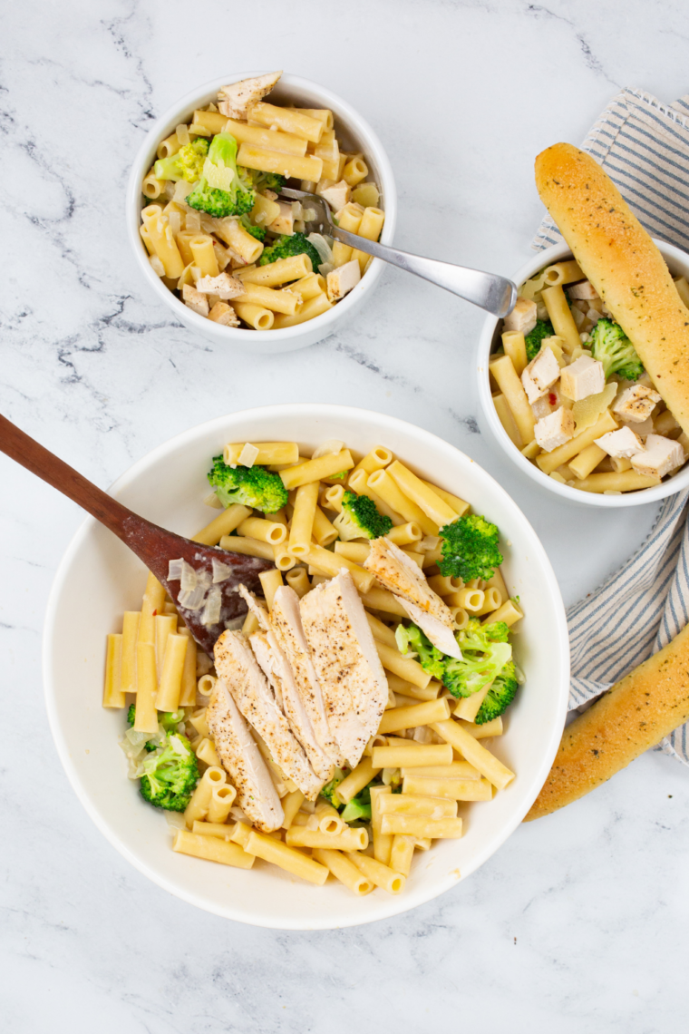 Baked chicken broccoli penne inspired by Fazoli&rsquo;s with creamy Alfredo sauce, tender chicken, roasted broccoli, and melted cheese on top