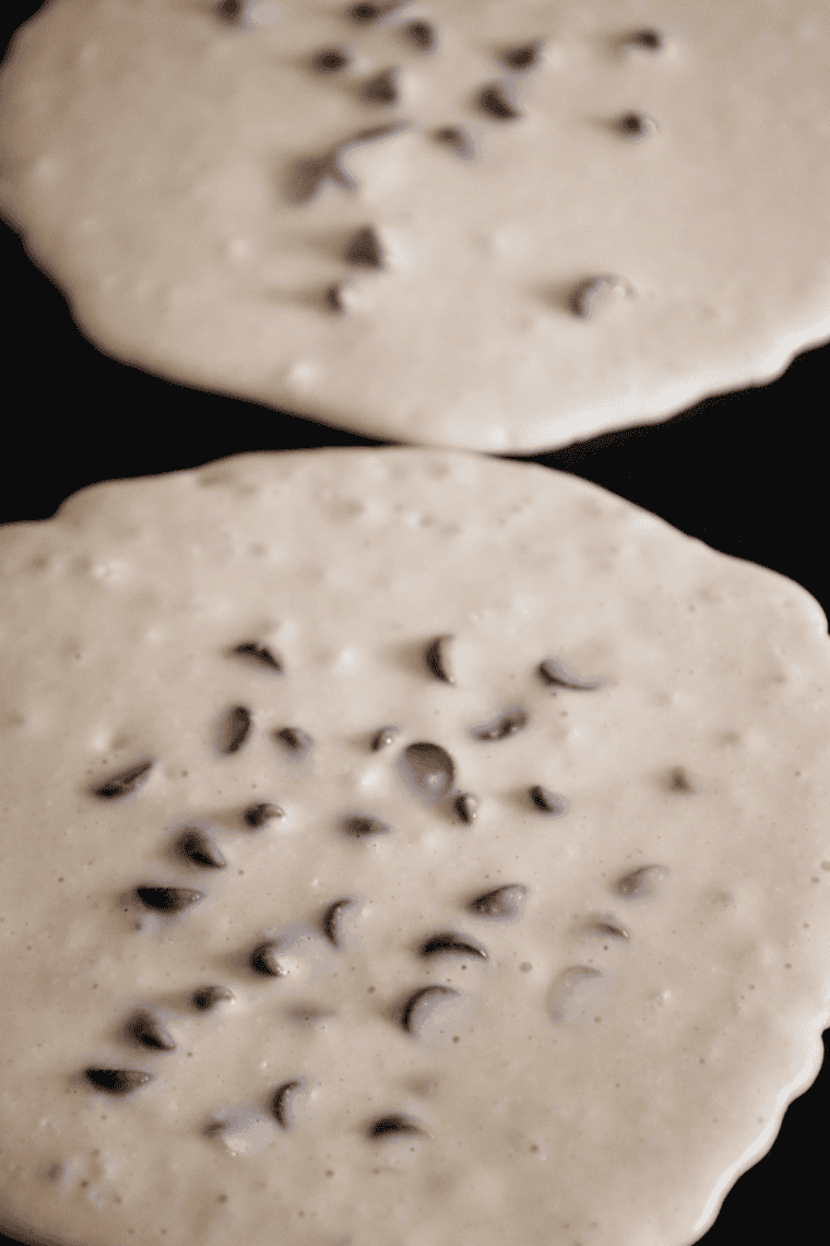 Heating buttered skillet or griddle over medium heat