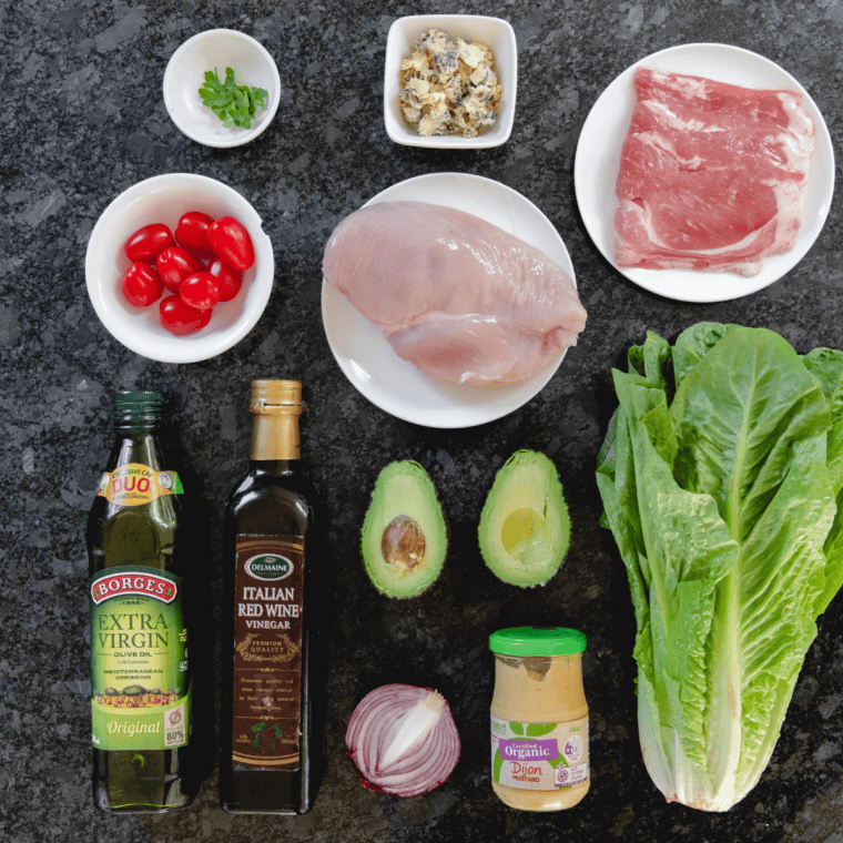 Ingredients needed for First Watch Copycat Cobb Salad Recipe on kitchen table.