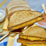 Golden grilled cheese sandwich made with sourdough bread, crispy buttered exterior, and melted cheese inside, inspired by First Watch.