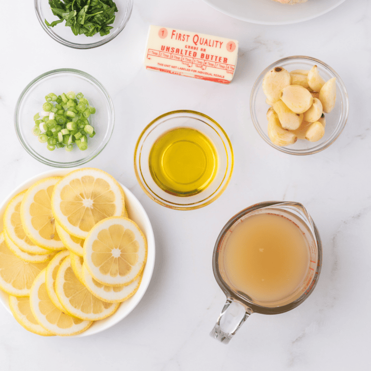 Ingredients needed for First Watch Lemon Dressing Recipe on kitchen table.