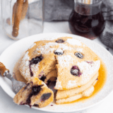 These First Watch Lemon Ricotta Pancakes are light, fluffy, and packed with bright lemon flavor balanced by creamy ricotta in every bite. Topped with fresh berries and a dusting of powdered sugar, they turn any breakfast into something that feels straight off a brunch menu.