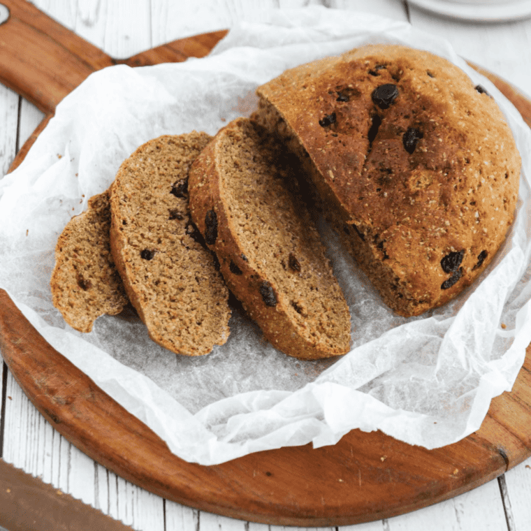 Freshly baked First Watch Multigrain Bread loaf with a golden crust and visible grains, ready to slice and serve.