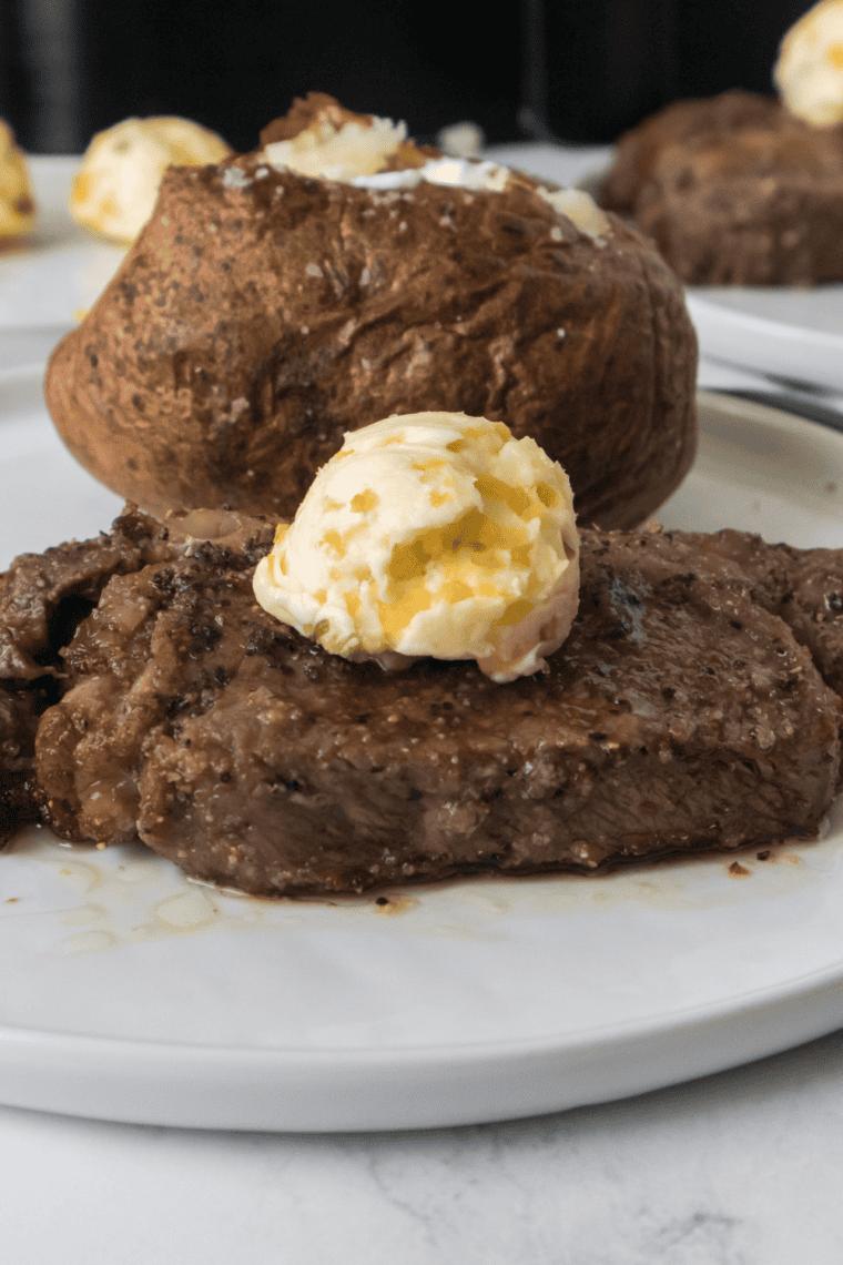 Creamy Gordon Ramsay peppercorn sauce in a pan with cracked black pepper, butter, and cream creating a rich, smooth steakhouse-style sauce.