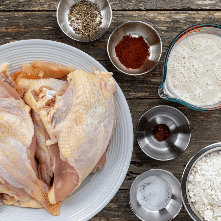 Ingredients needed for Gordon Ramsay&rsquo;s Buttermilk Fried Chicken on kitchen table.
