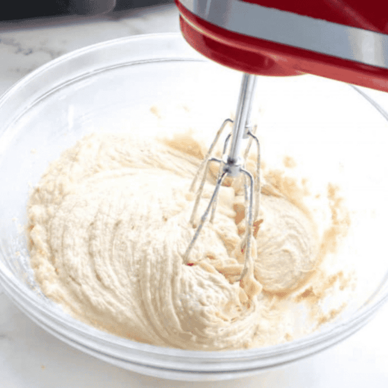 Sour cream and mayonnaise mixed in bowl until smooth and creamy