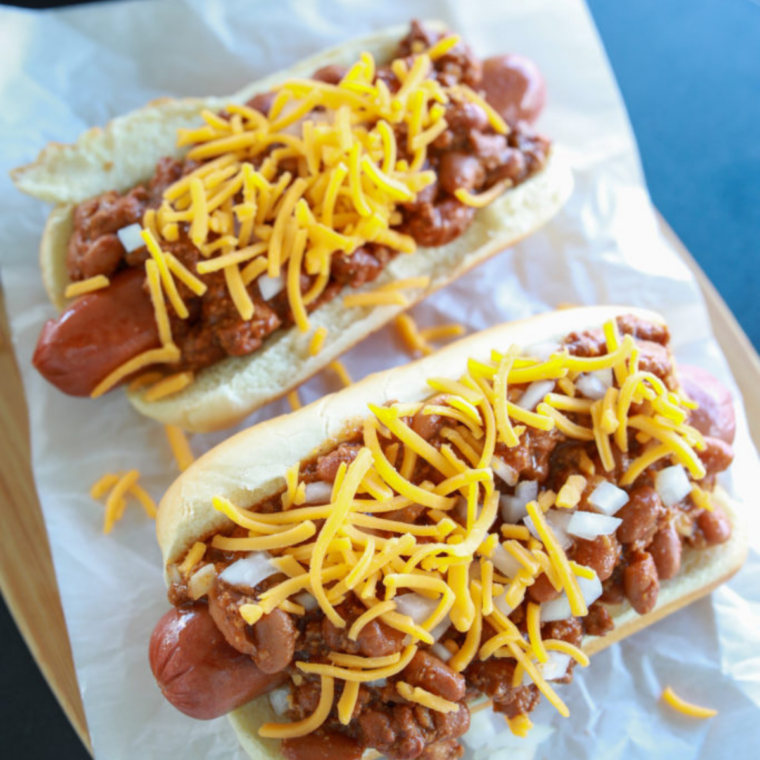 Hot dogs steaming in an Instant Pot, fully cooked and juicy, ready to be served in soft buns with toppings.