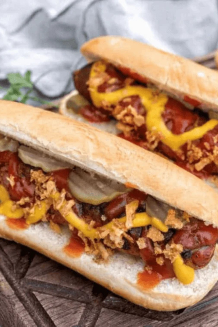 Hot dogs steaming in an Instant Pot, fully cooked and juicy, ready to be served in buns with toppings.