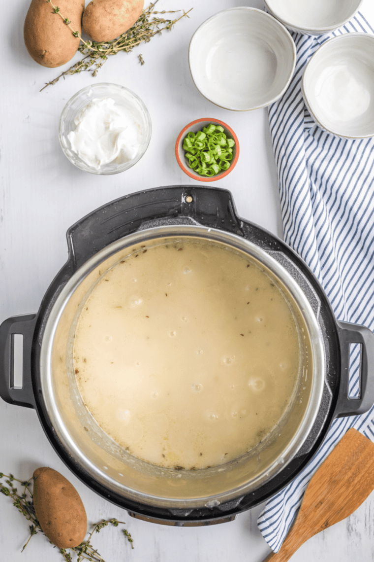 Instant Pot sealed cooking potato soup under high pressure for creamy texture