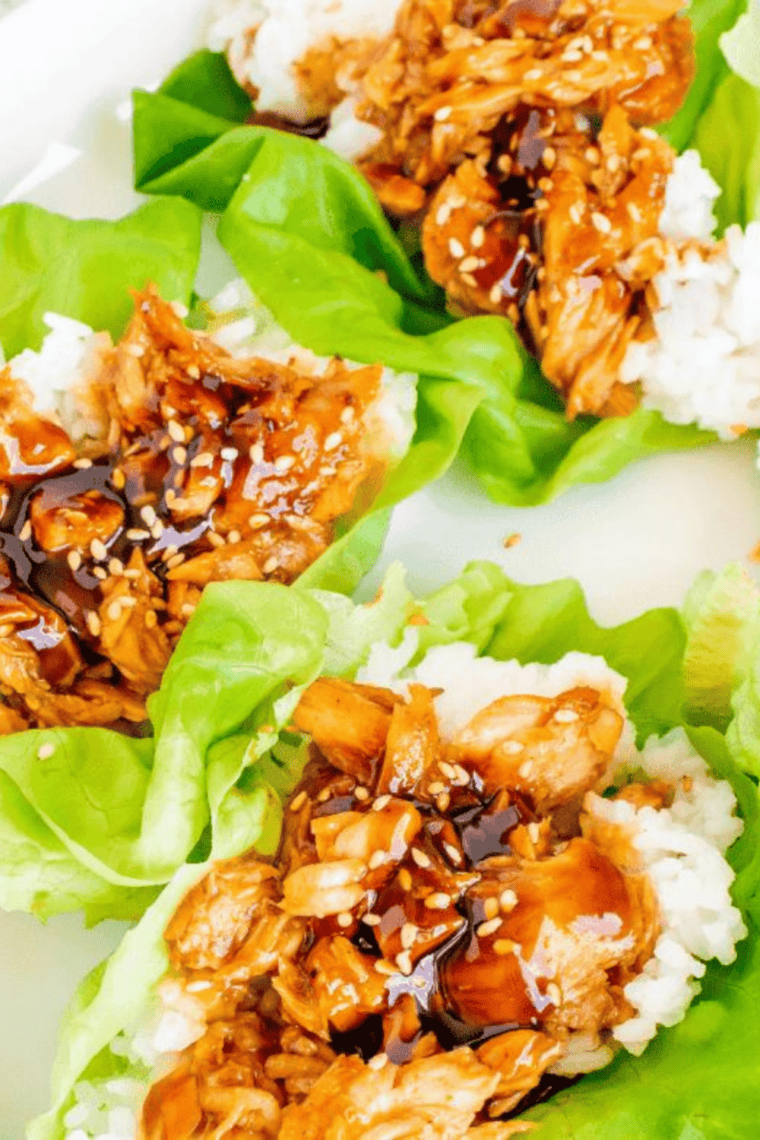 Glossy homemade teriyaki sauce in a bowl with sweet and savory glaze texture served with chicken, rice, and vegetables for drizzling, dipping, or glazing.