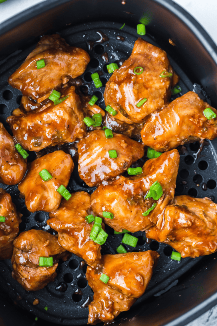 Glossy homemade teriyaki sauce in a bowl with sweet and savory glaze texture served with grilled chicken, rice, and vegetables for drizzling or dipping.