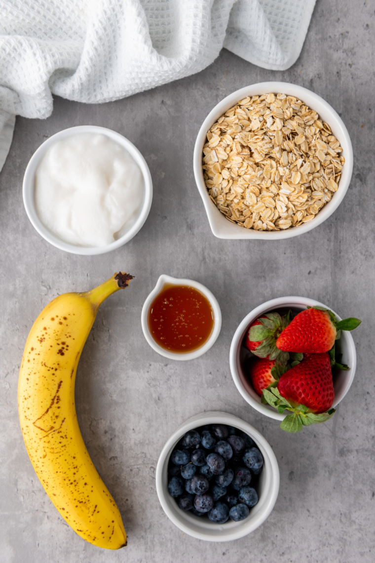 Ingredients needed for Red, White & Blue Granola Berry Cups: Perfect 4th of July Potluck Food on kitchen table.