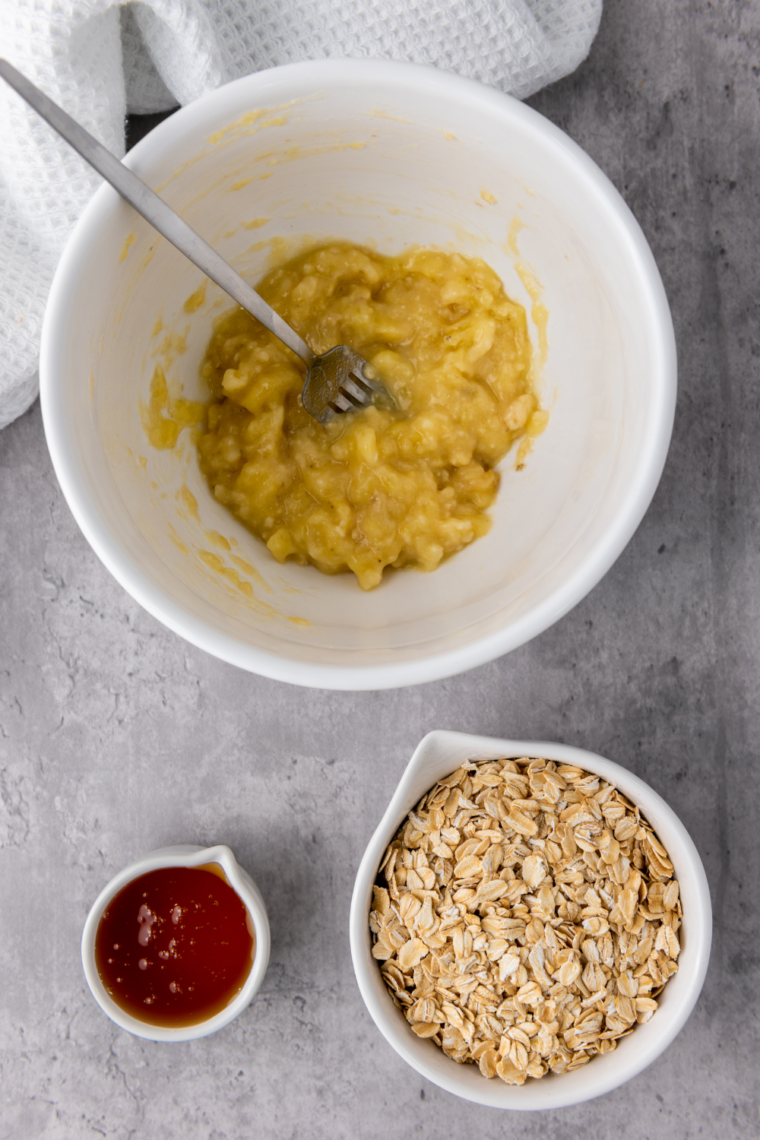 Oats and honey mixed into mashed banana sticky mixture