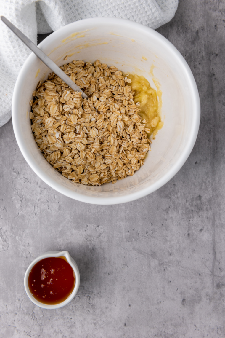 Oat mixture pressed into muffin pan forming cup shapes