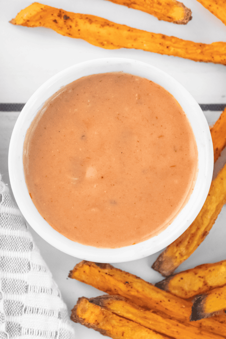 Small bowl of creamy Sonic Groovy Sauce served as a dipping sauce for fries and crispy chicken.