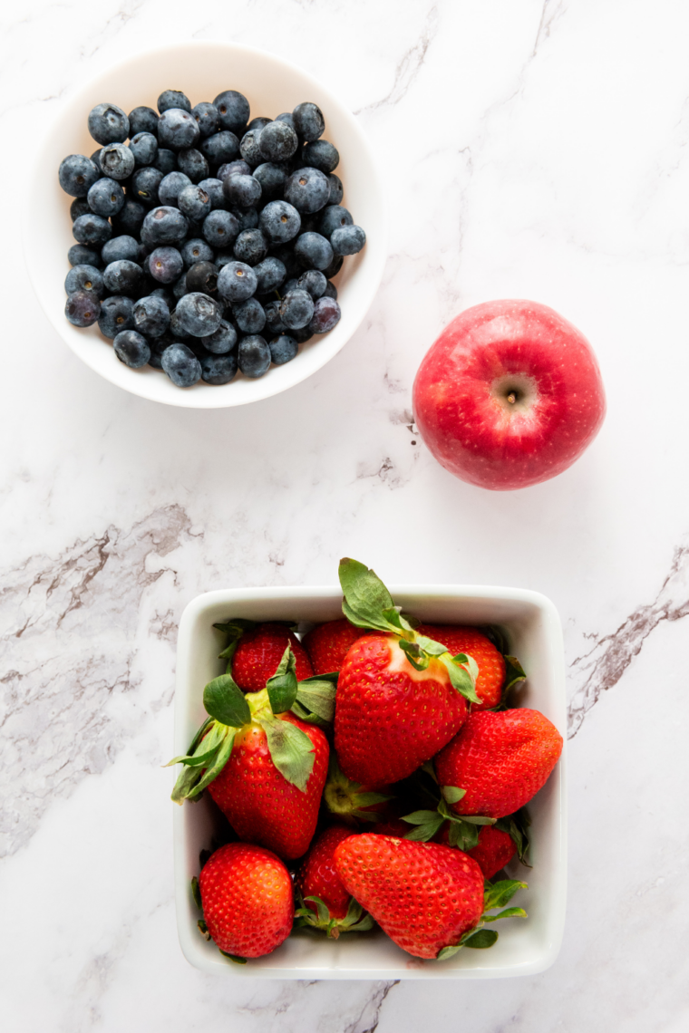 Ingredients needed for Star-Spangled Fruit Salad on kitchen table.