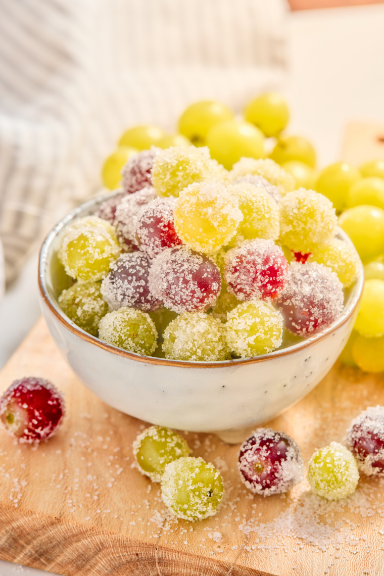 Bowl of sugar coated grapes with a sparkling crunchy sugar coating on fresh grapes