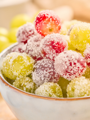 Sugar coated grapes in a bowl with a sparkling sugar coating on fresh green grapes