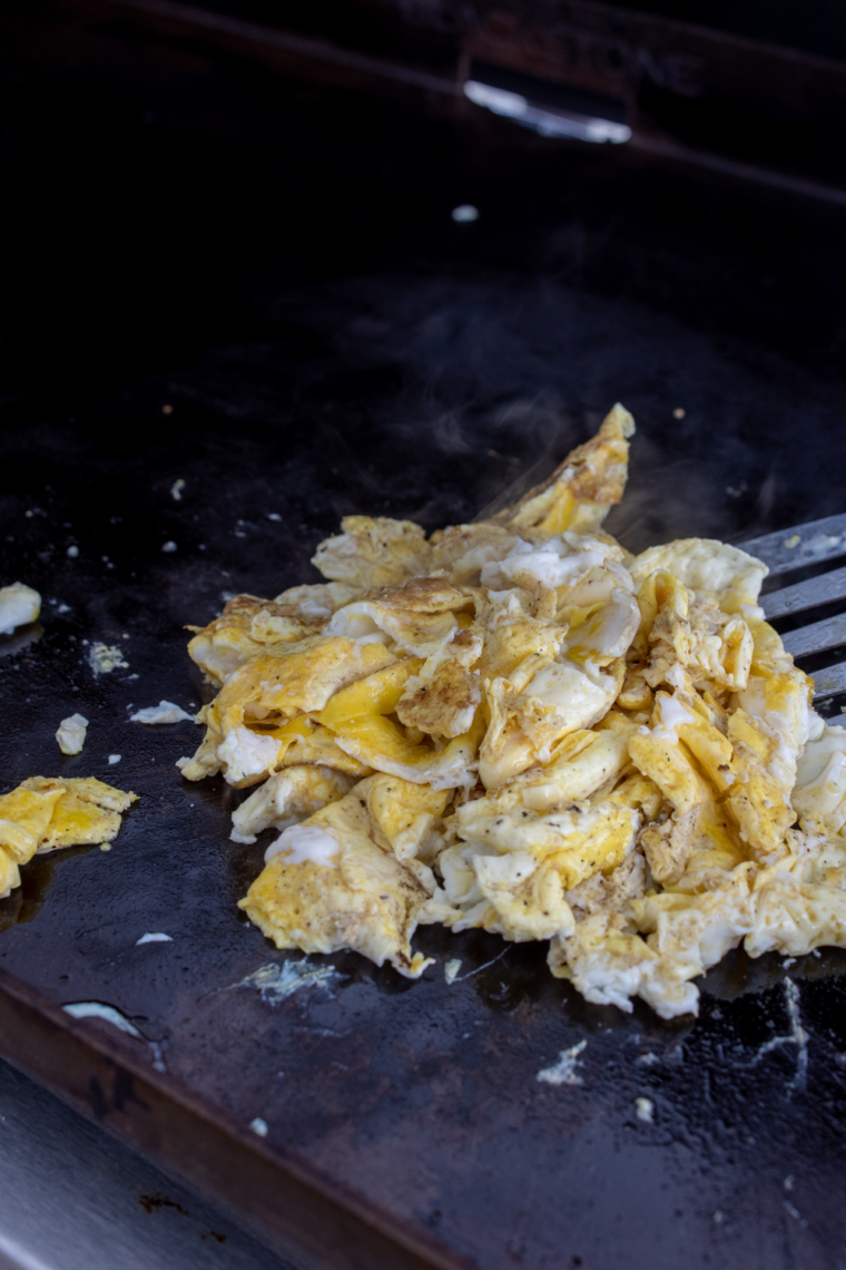 Blackstone griddle preheating with burners on high and oil spread evenly across surface