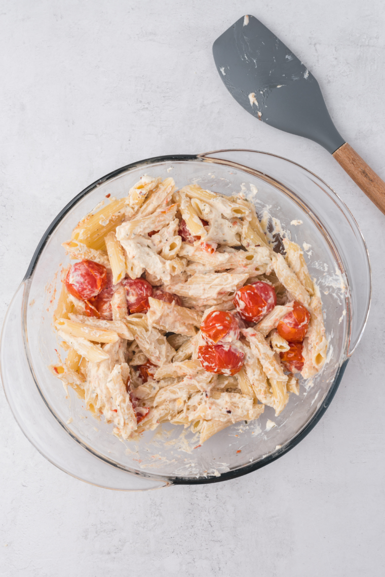 Boursin cheese melting with burst cherry tomatoes in air fryer
