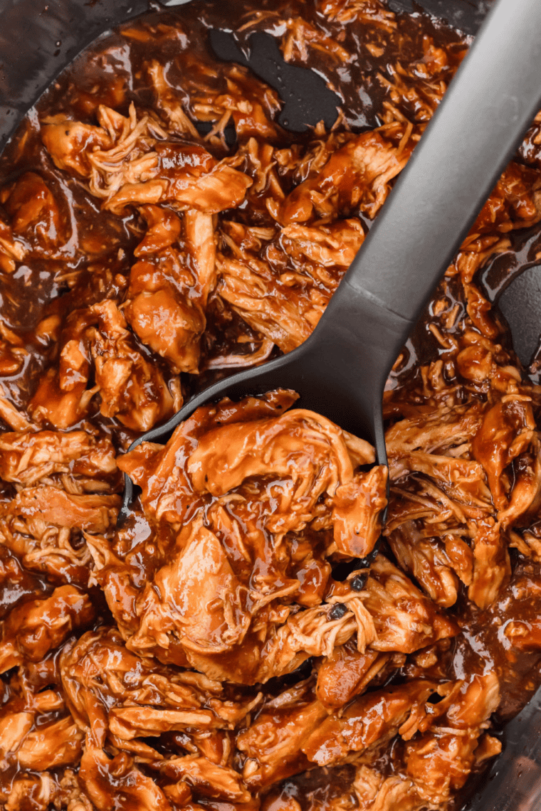 Homemade Wood Ranch BBQ sauce in a bowl with rich smoky red color, served with grilled meats, ribs, and burgers for dipping