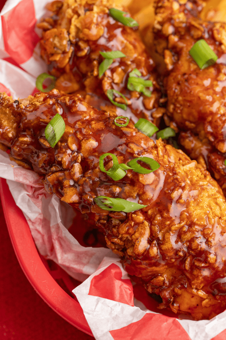 Homemade Wood Ranch BBQ sauce in a bowl with rich smoky red color, served with grilled meats, ribs, and burgers for dipping