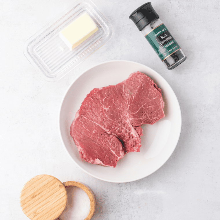 Ingredients for air fryer round steak: eye of round steaks, oil, salt, pepper, and steak seasoning