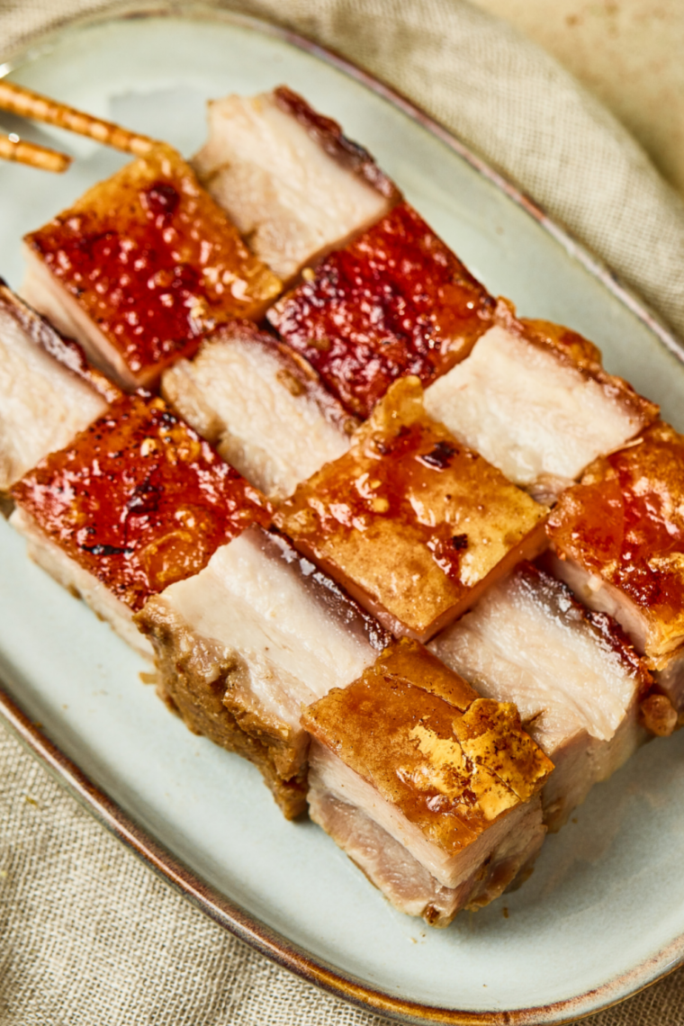 Homemade Chinese crispy pork belly cooked in the air fryer with blistered skin.