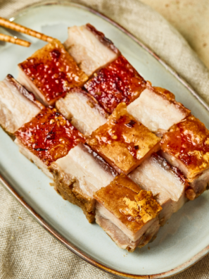 Plate of Air Fryer Siu Yuk with crispy crackling skin sliced into squares