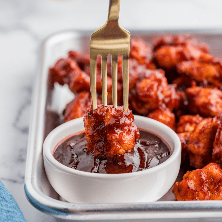 Close-up of Burger King style barbecue sauce with a smooth, glossy texture.