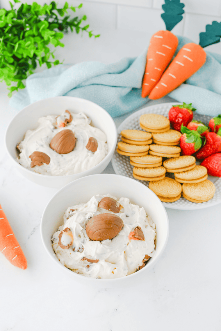 No-bake Easter dessert dip surrounded by graham crackers, pretzels, and strawberries for dipping