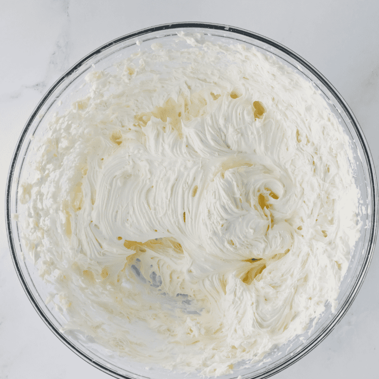 Beat the base Hand mixer whipping cream cheese, powdered sugar, and vanilla into smooth Cadbury Egg Dip base