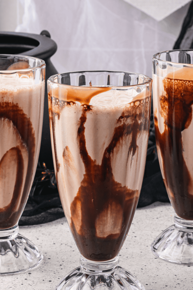 caramel macchiato milkshake with whipped cream, caramel sauce, and coffee swirl