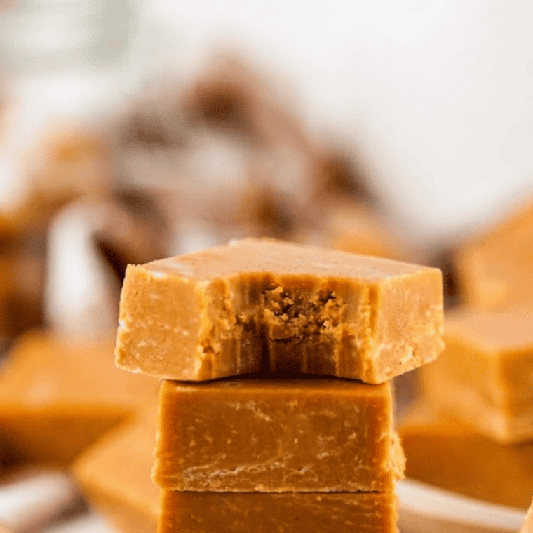 Set chocolate caramel marble fudge cut into squares on parchment with a warm knife for clean edges