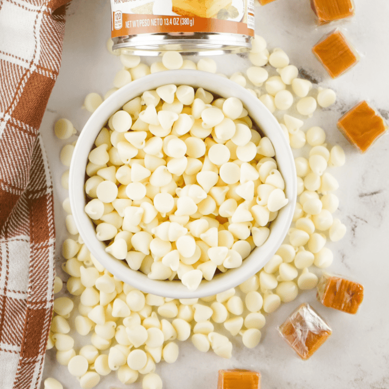 Ingredients for chocolate caramel marble fudge: chocolate chips, sweetened condensed milk, soft caramels, white chocolate chips, butter, heavy cream, and vanilla