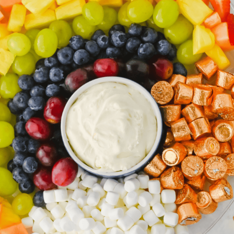 Creamy copycat Jason&rsquo;s Deli fruit dip served with fresh strawberries, grapes, and pineapple