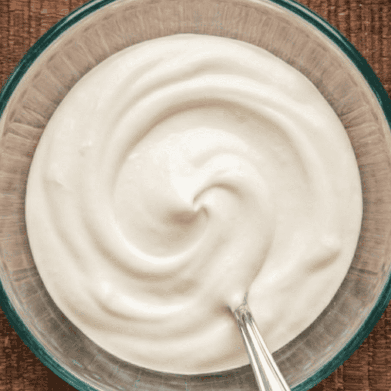 Three-ingredient copycat Jason's Deli creamy liqueur fruit dipping sauce in a small glass bowl