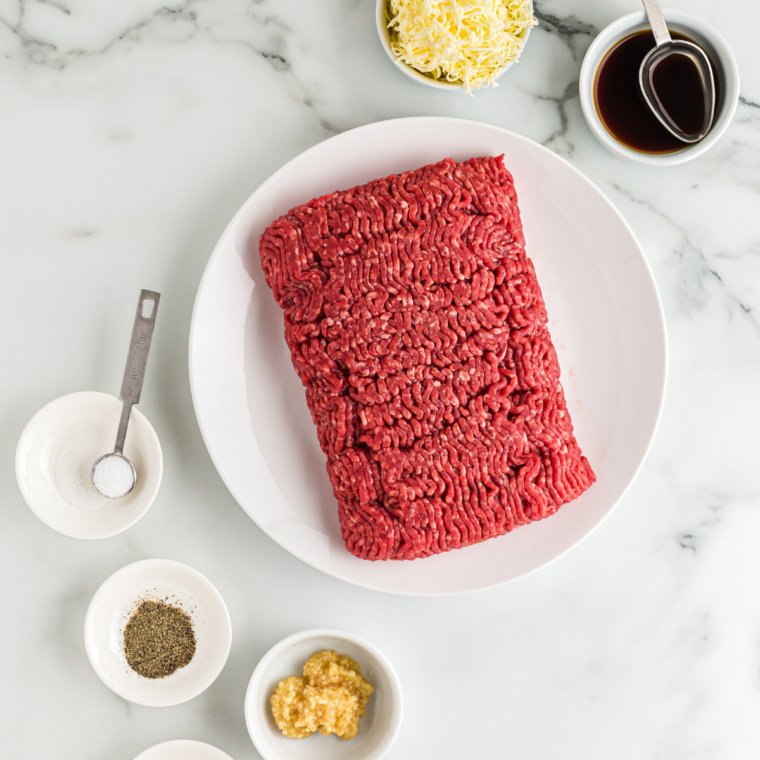 Ingredients needed for Copycat McDonald's Cheeseburger Recipe on kitchen table.