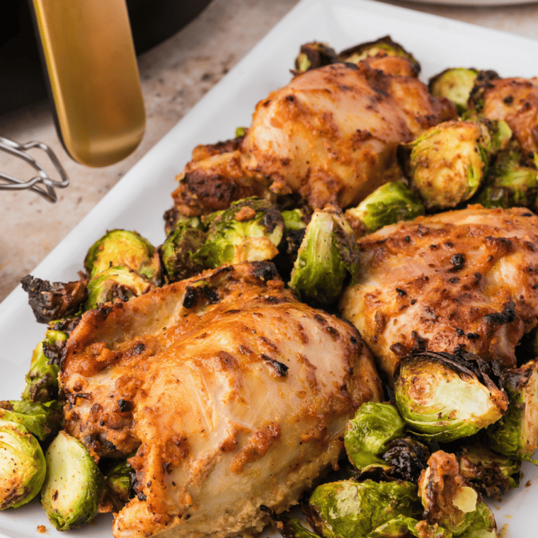 Hot honey sauce drizzled over crispy chicken tenders with a glossy finish.