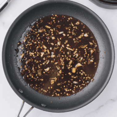 Homemade copycat McDonald's hot honey sauce served in a small dipping bowl.