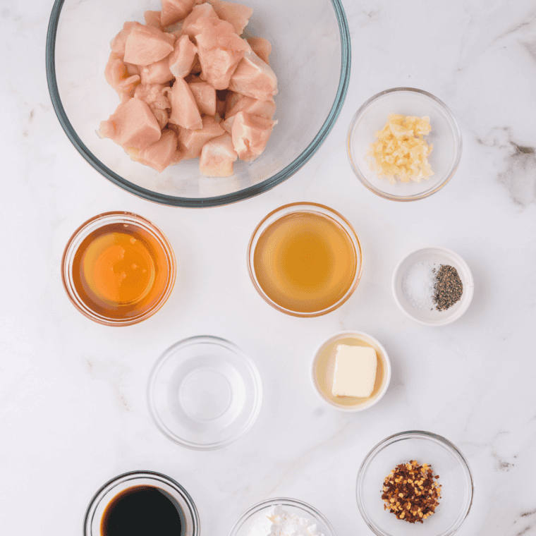 Ingredients needed for Copycat McDonald's Hot Honey Sauce on kitchen table.
