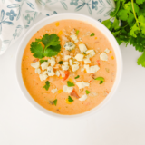 Creamy crock pot buffalo chicken chili with ground chicken, white beans & ranch. Easy slow cooker recipe perfect for game day or weeknight dinners!