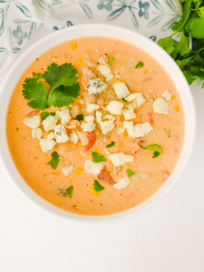 Creamy crock pot buffalo chicken chili with ground chicken, white beans & ranch. Easy slow cooker recipe perfect for game day or weeknight dinners!
