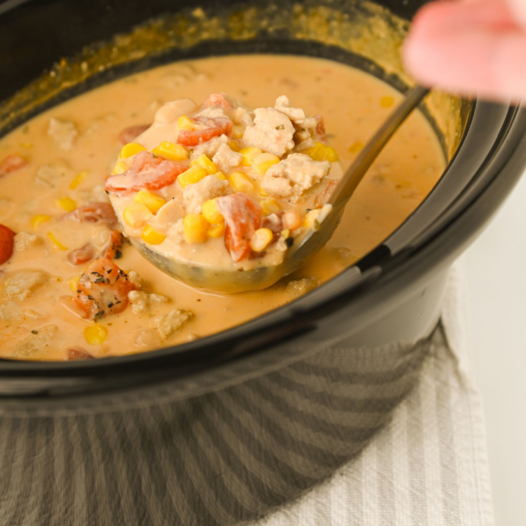 Slow cooker buffalo chicken chili cooking with the lid on during the low and slow simmering process