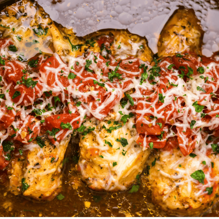 Crockpot bruschetta chicken topped with fresh cherry tomato and basil bruschetta