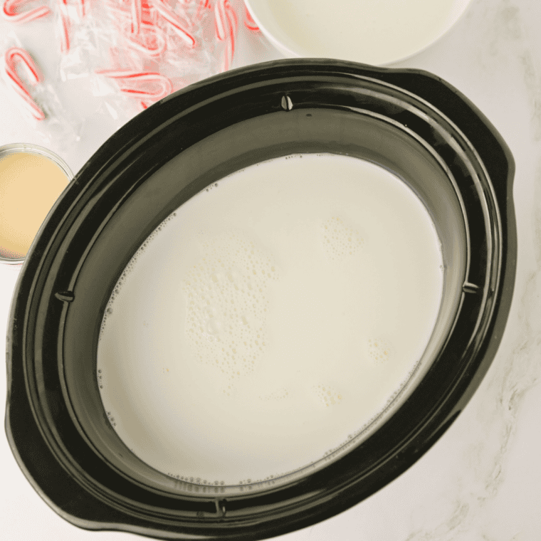 Whisking unsweetened cocoa powder and milk into a smooth paste in a small white bowl