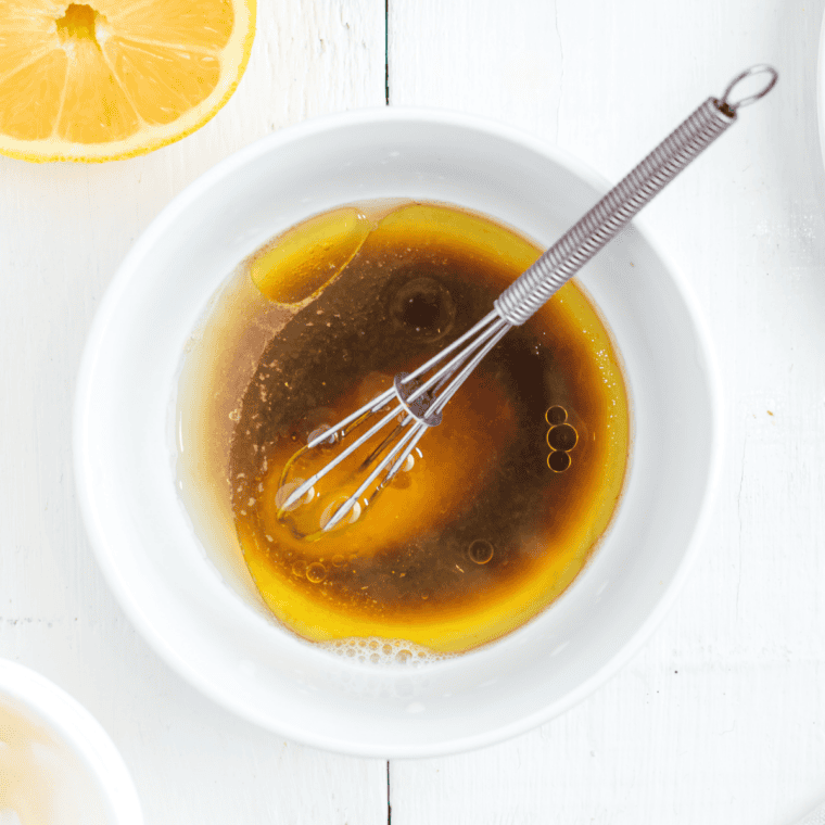 Whisk together the marinade: a bright Greek-style mix of olive oil, fresh lemon juice, minced garlic, and oregano until smooth and well combined.