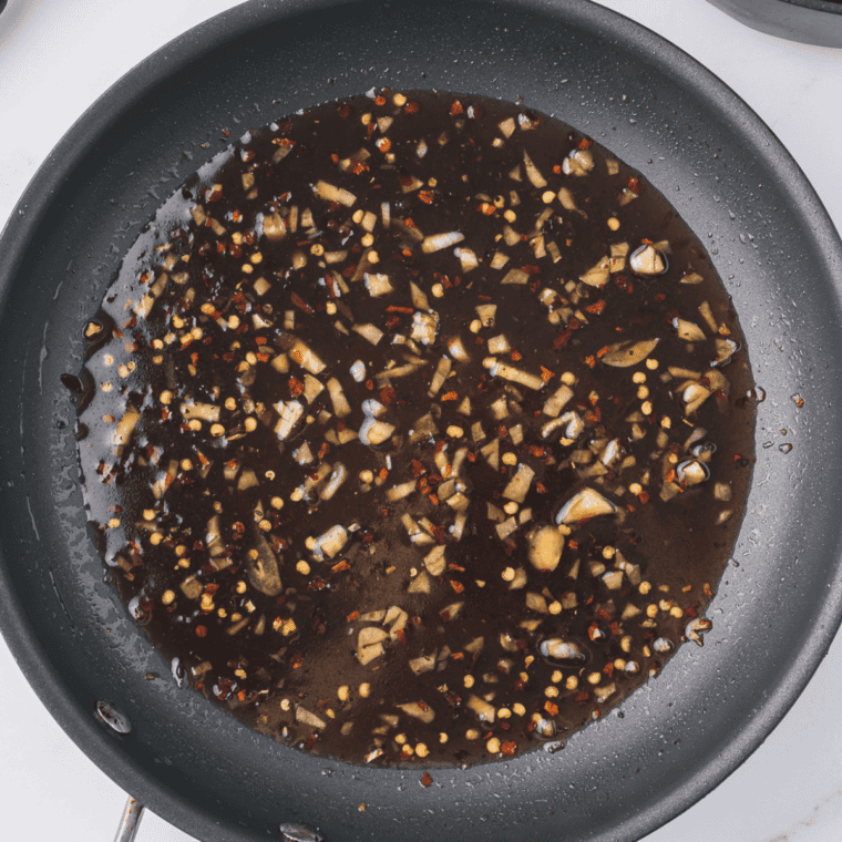 Honey garlic sauce base ingredients whisked together in saucepan before heating begins