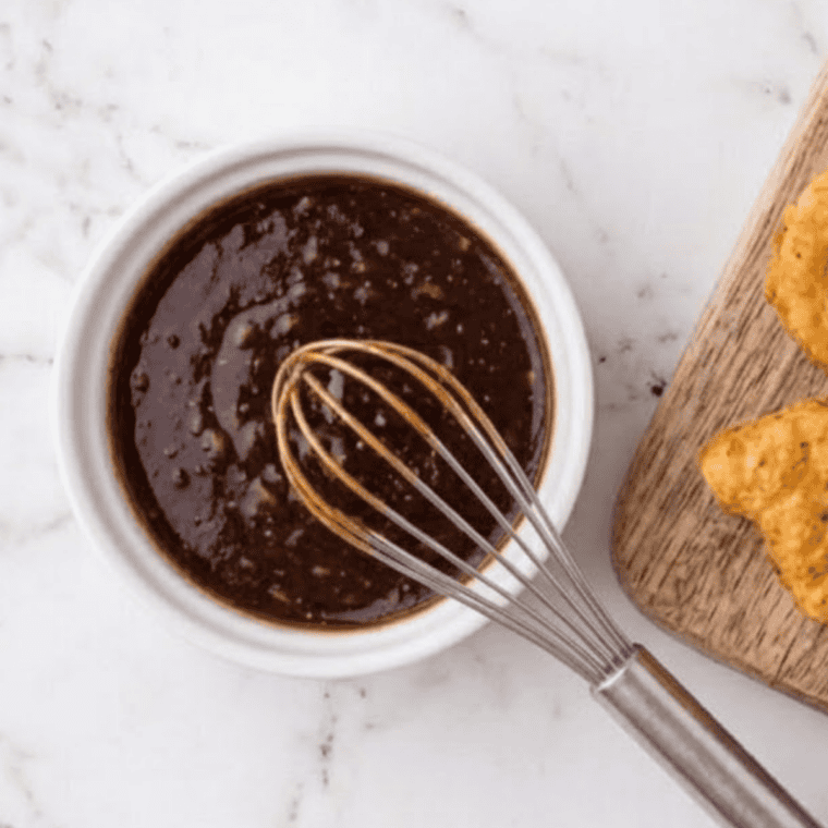 Smoky chipotle BBQ dipping sauce recipe served with golden chicken nuggets